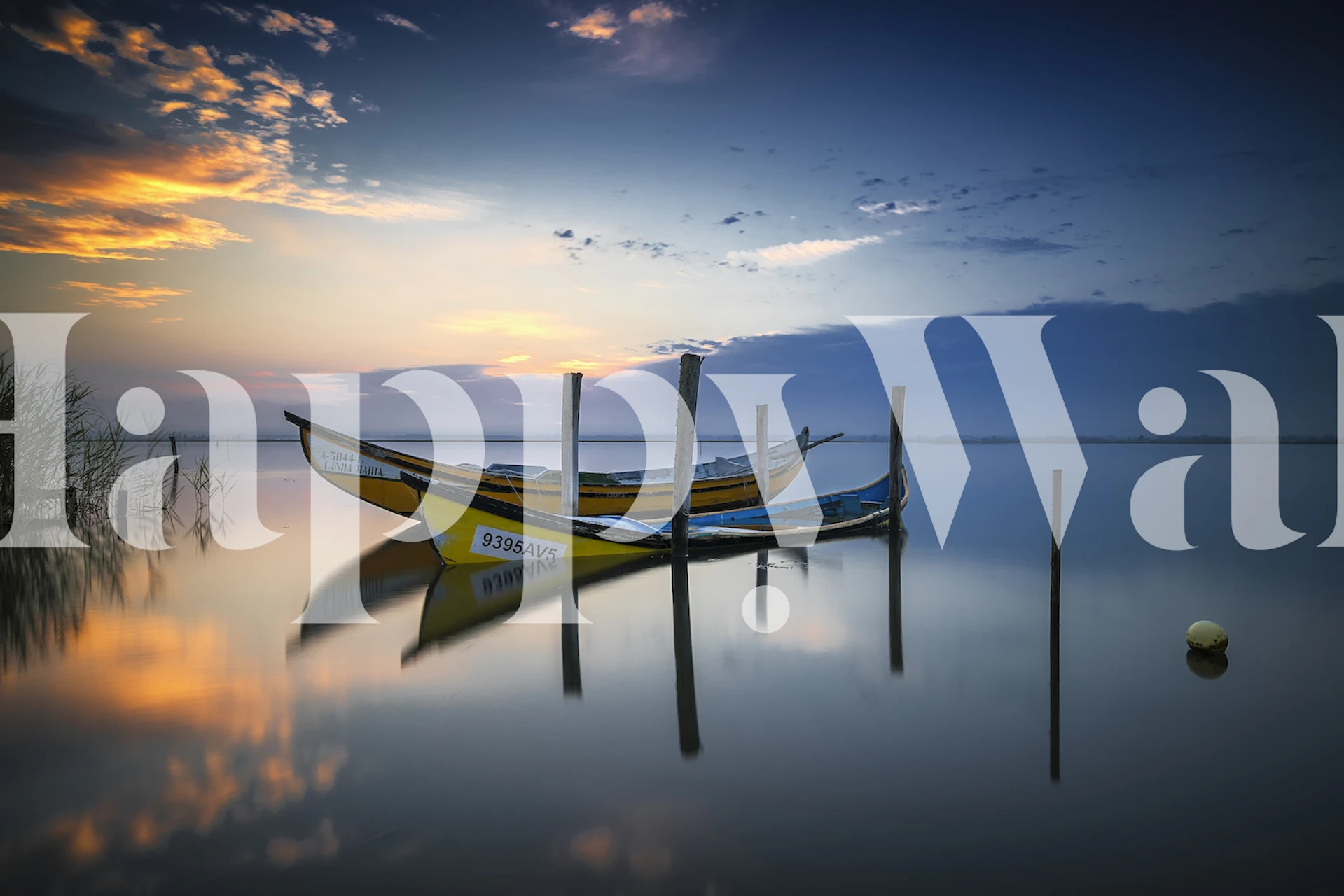 two boats in still water at sunset with reflections wallpaper