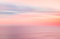 Pink sunset sky on ocean tapet