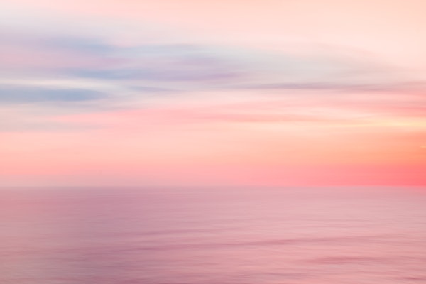 Pink sunset sky on ocean