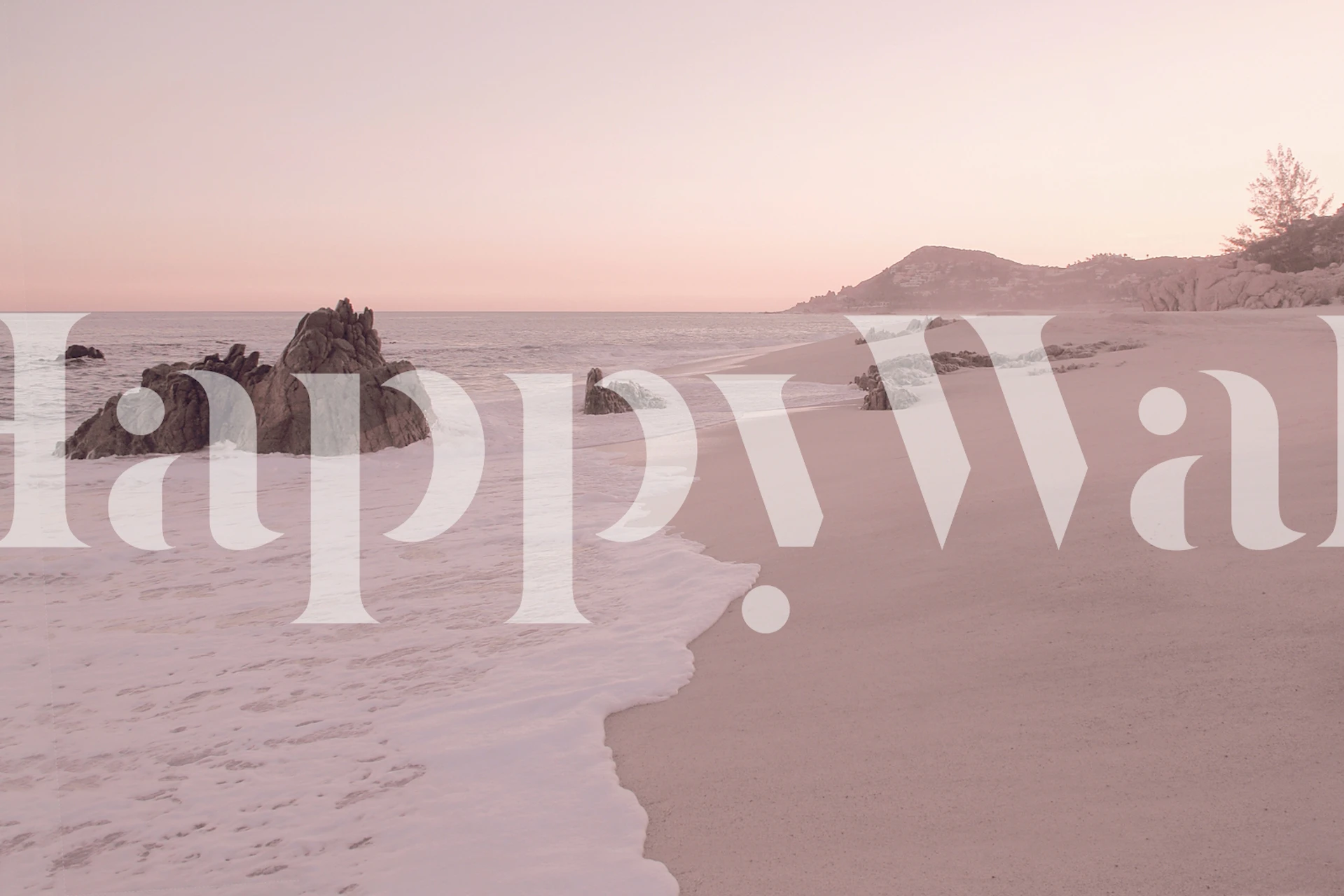 Peaceful beach scene with golden hues, waves, and rocks wallpaper