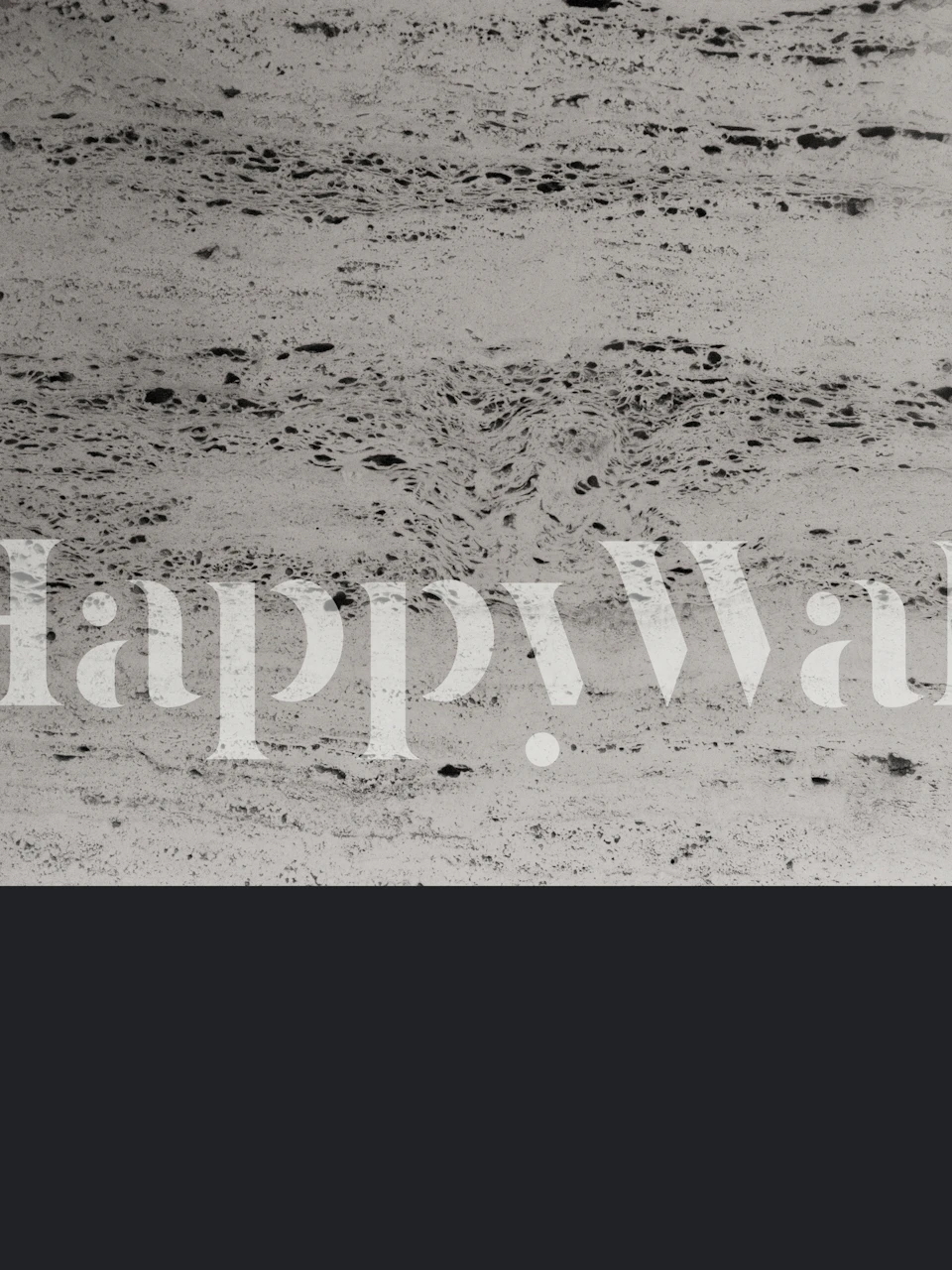 Charcoal on Concrete-tapetti esitelty huoneessa