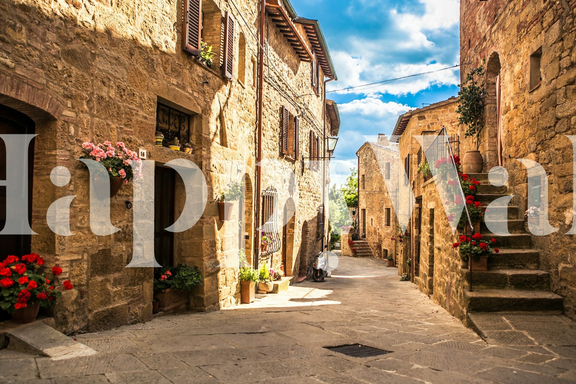 Rustic stone alley with colorful flowers and blue sky wallpaper