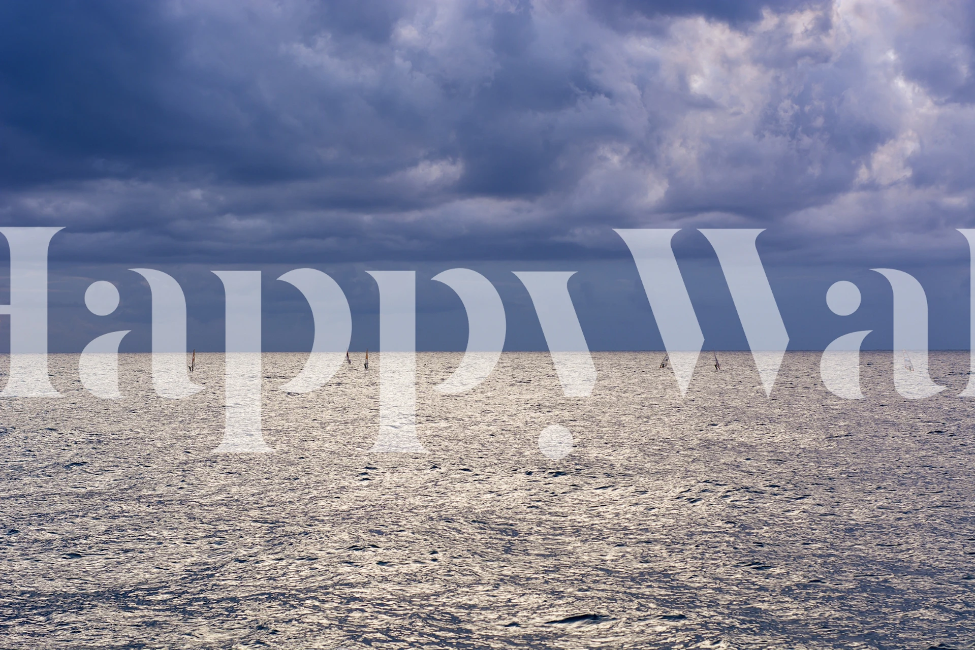 Ocean view wall mural with clouds and shimmering sunlight reflections on water