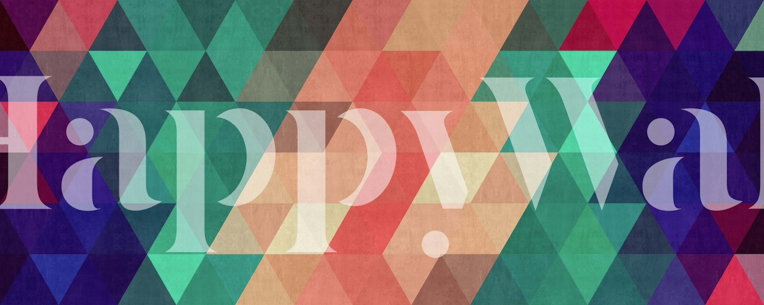 Colorful geometric triangle wallpaper in various shades