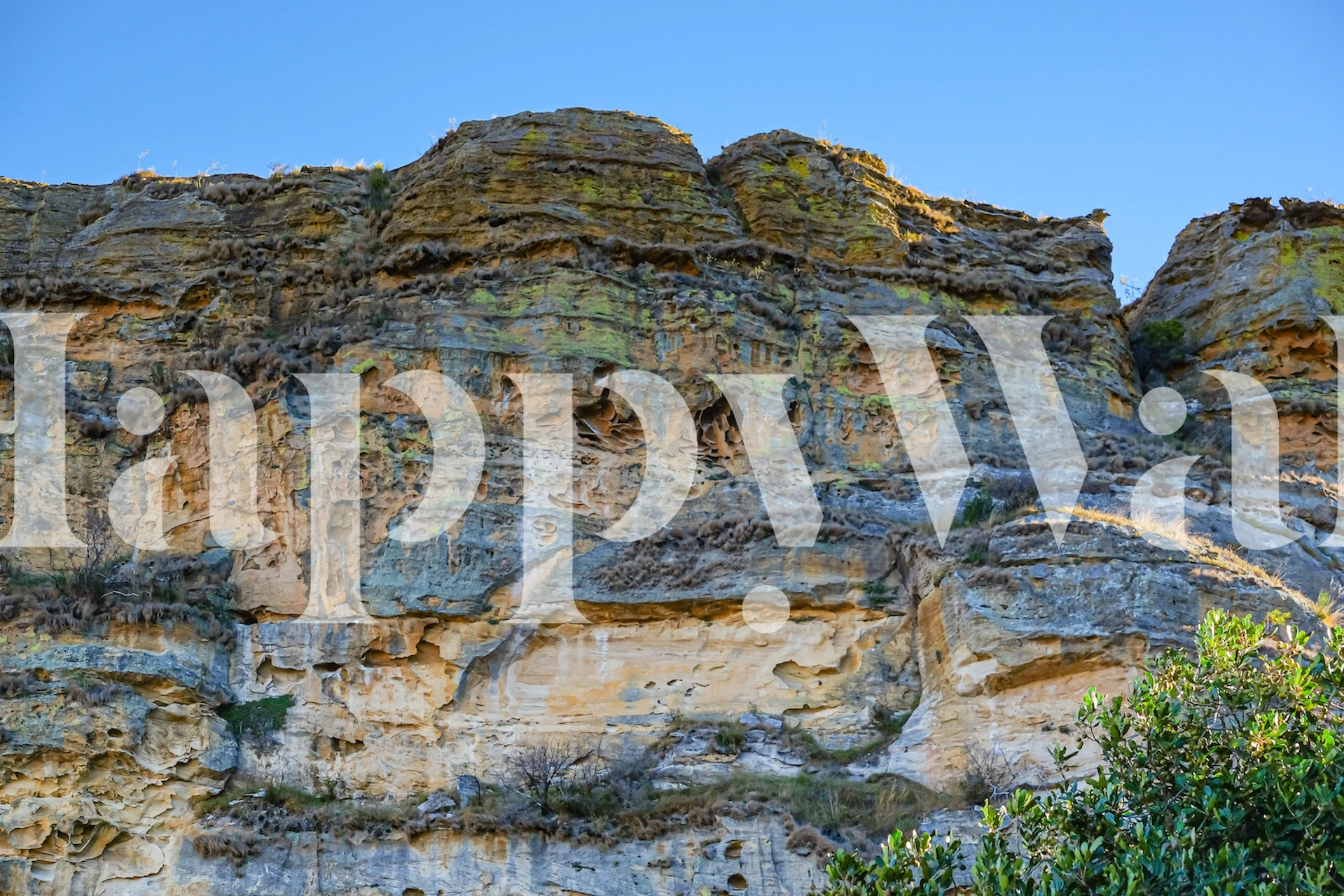 Natural rock formation with earthy tones and textures wallpaper