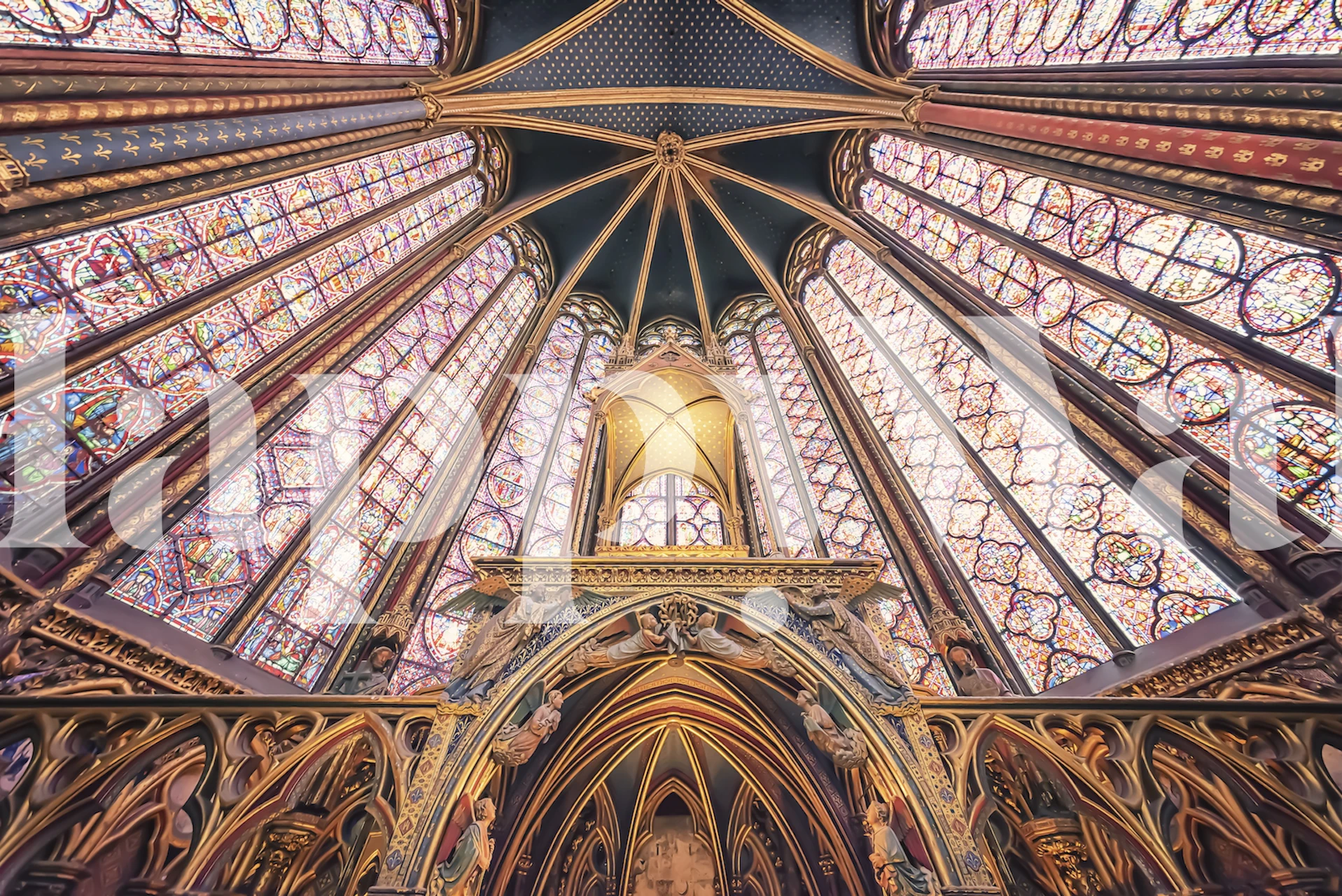 The Sainte-Chapelle Gothic architecture wall mural featuring the iconic ceiling's vibrant patterns and hues.