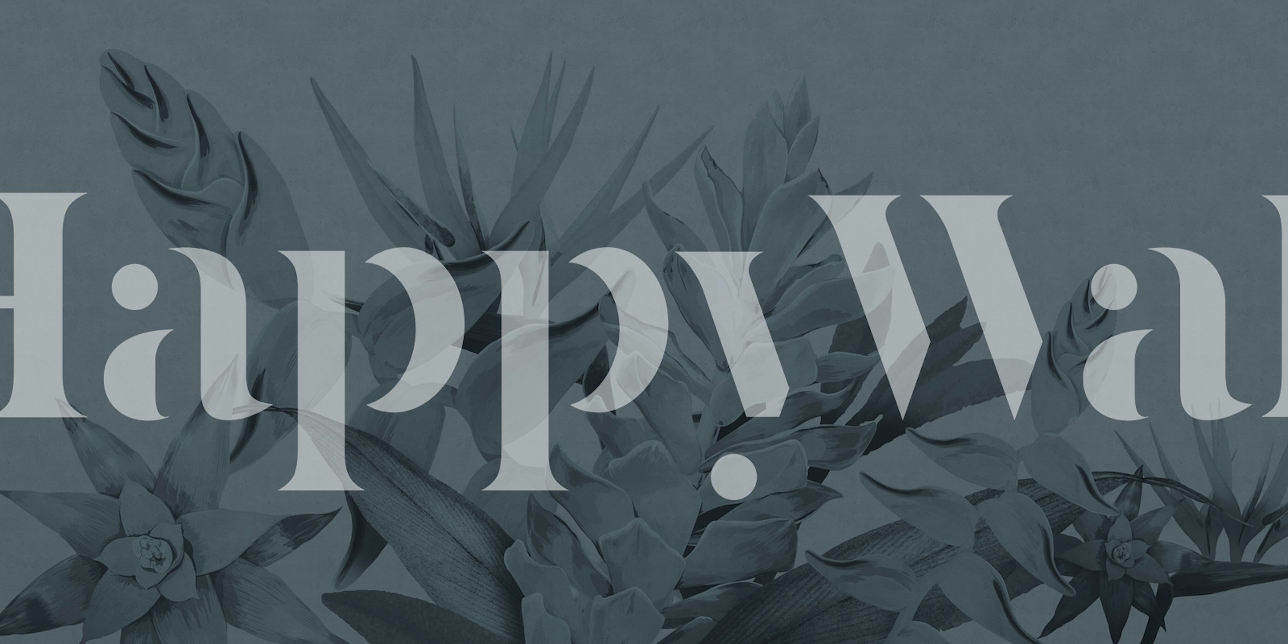 Tropical floral pattern in shades of blue wallpaper