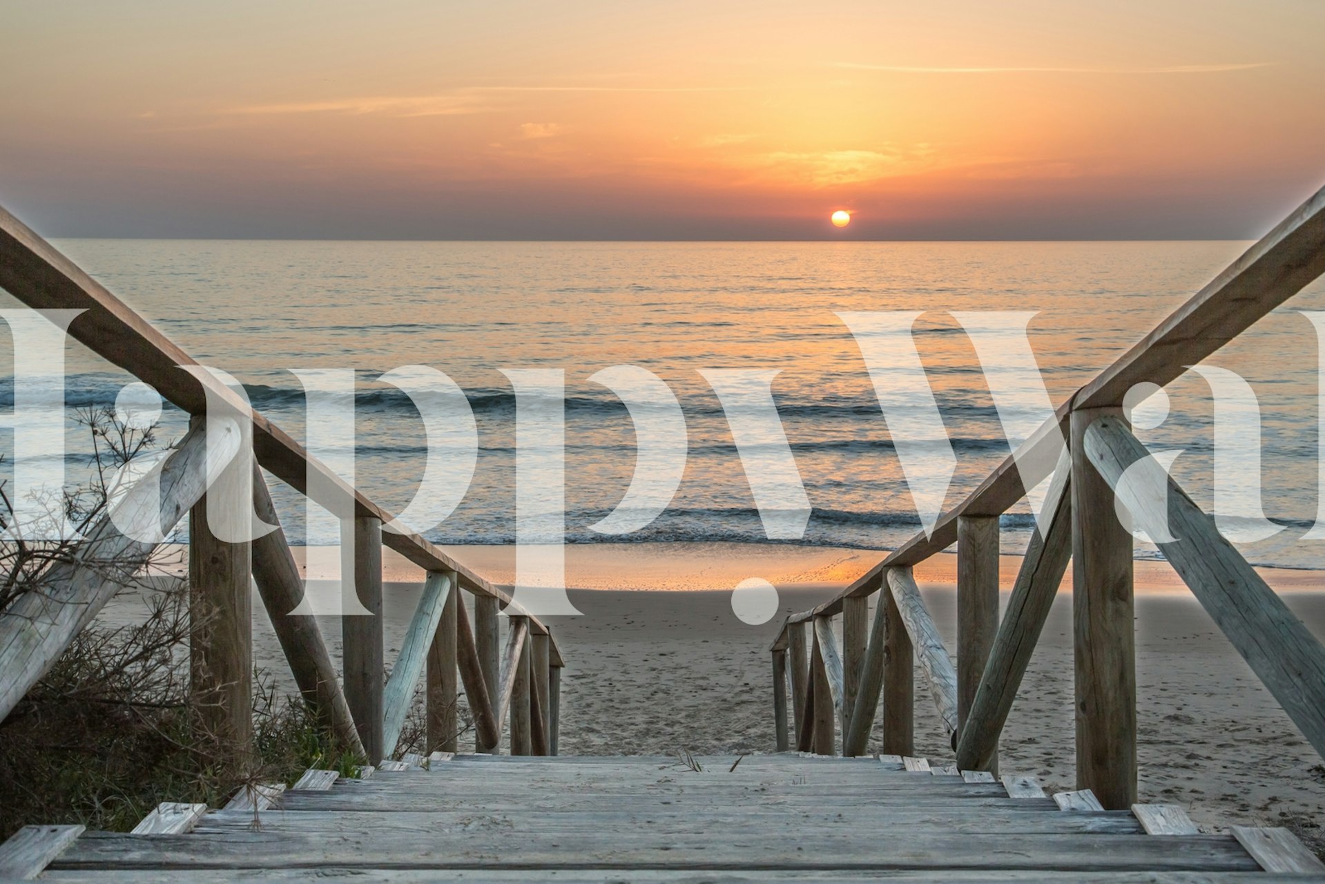 Beach steps leading to sunset over the ocean wallpaper