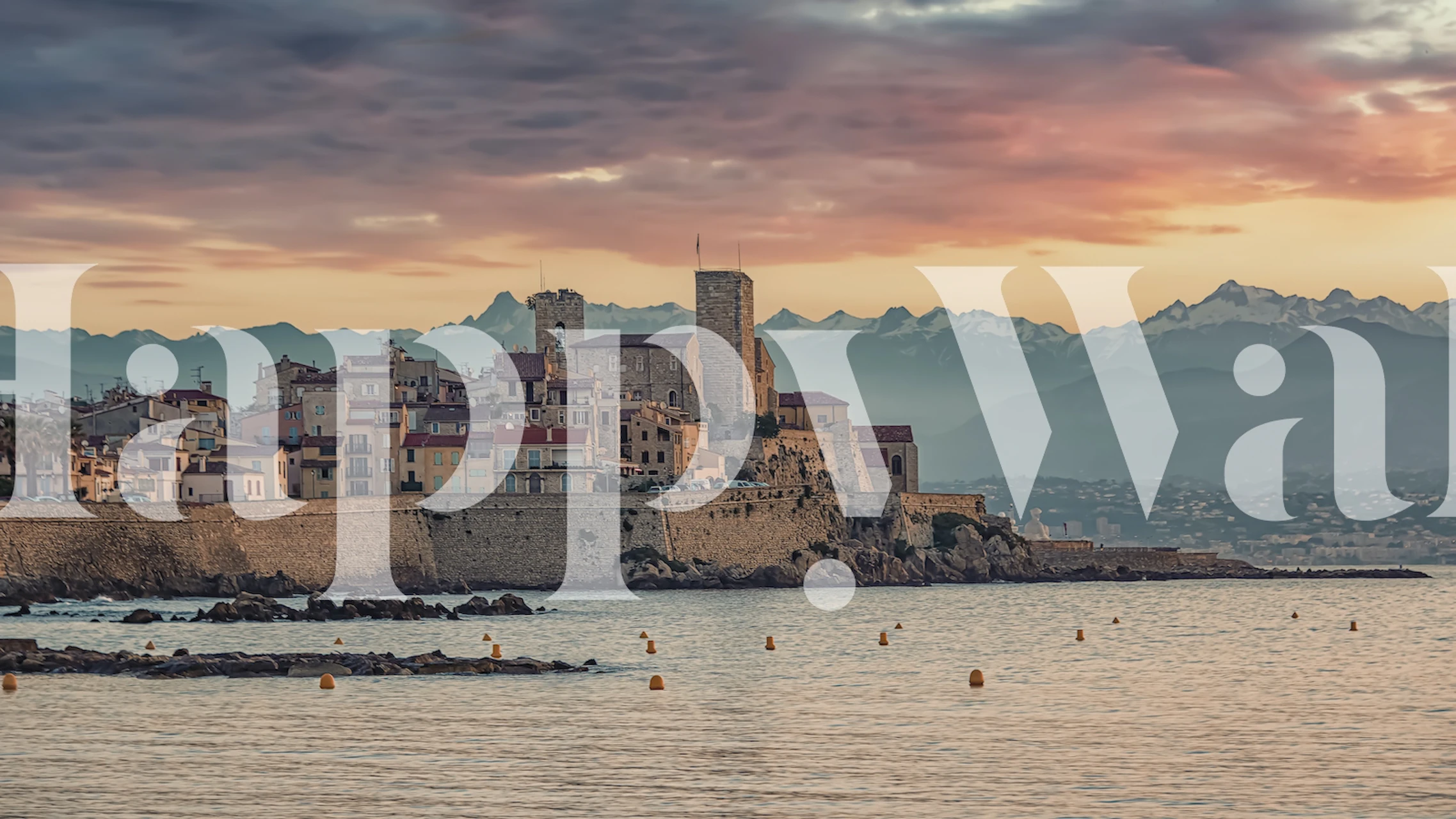 Coastal landscape with sunset hues blue and orange wallpaper