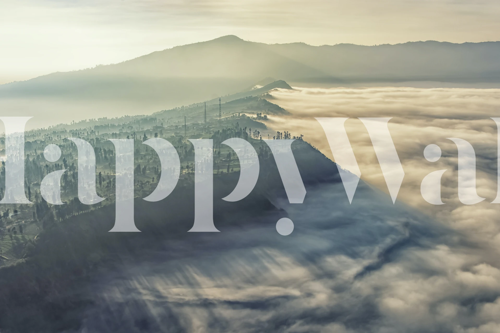 Mountain landscape with clouds and mist wallpaper