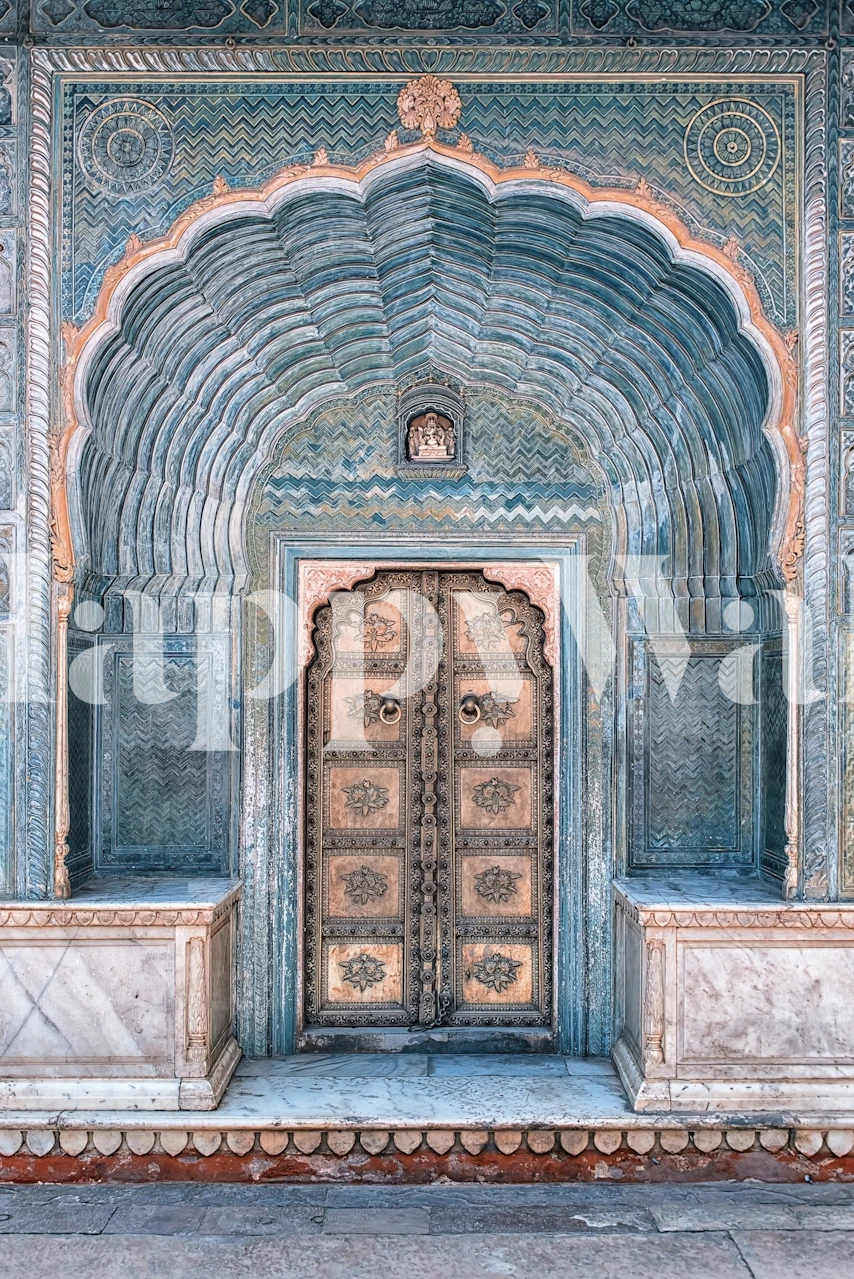 Vintage Indian door with ornate carvings, blue-gray and gold colors, heritage style wallpaper