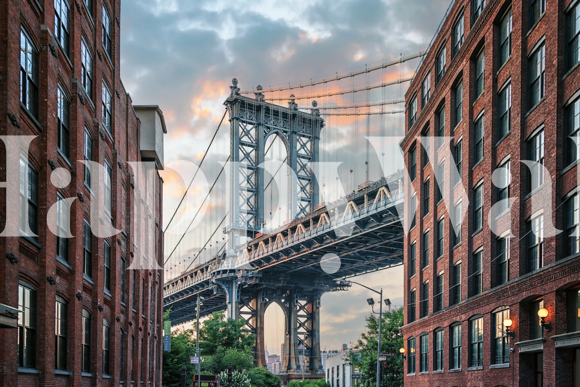 Manhattan Bridge at sunset with clouds and historic buildings wallpaper