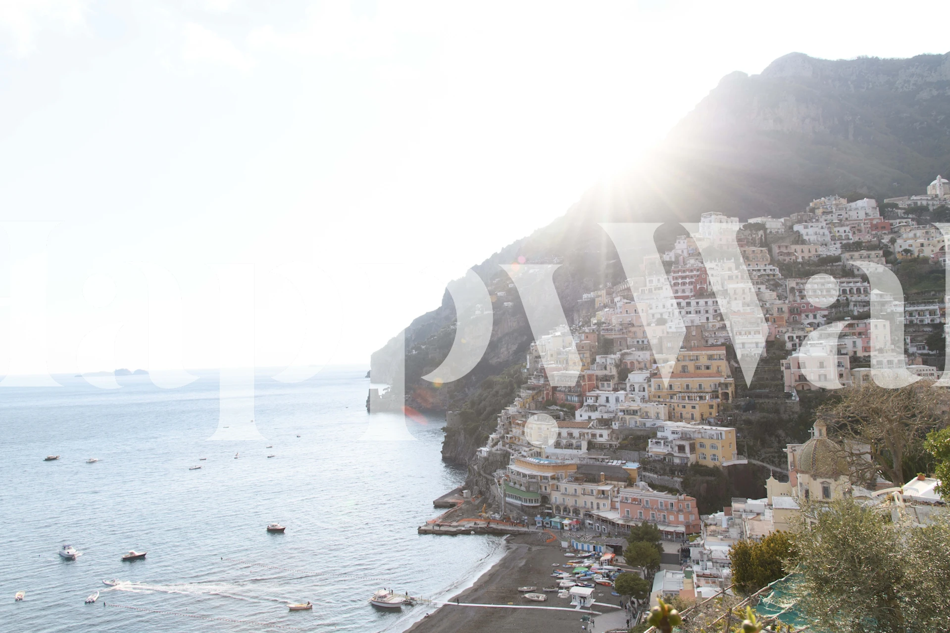 Coastal view wallpaper featuring pastel houses and sea tones