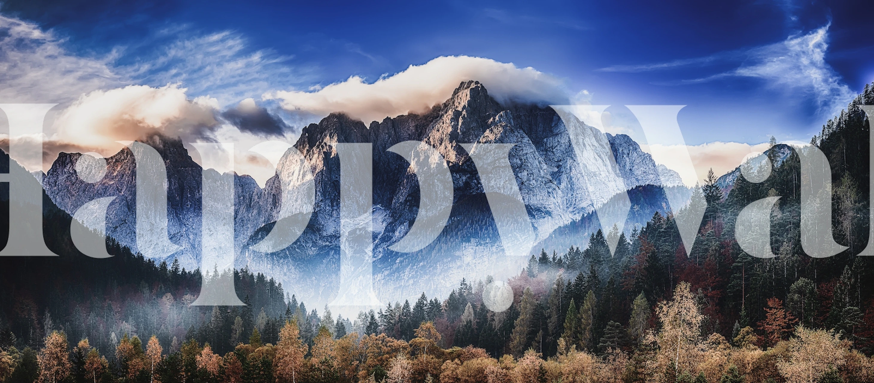 Mountain peaks with blue sky and colorful trees wallpaper