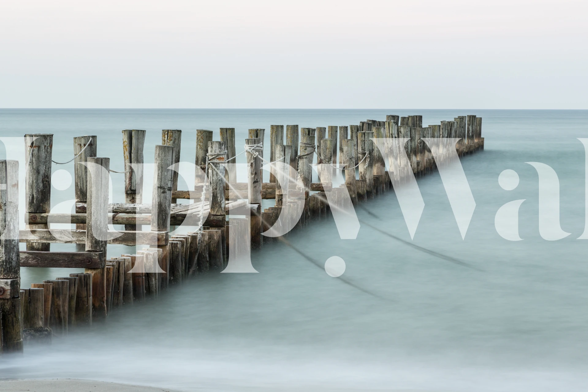 Old jetty and calm water in muted tones wallpaper