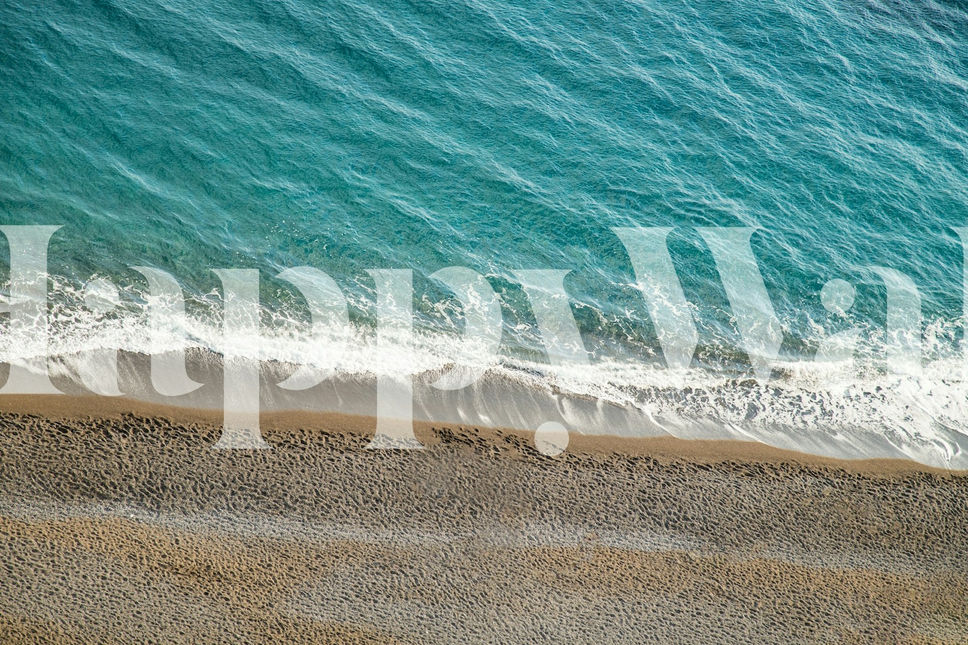 Beach wave pattern with turquoise water and sandy shore wallpaper