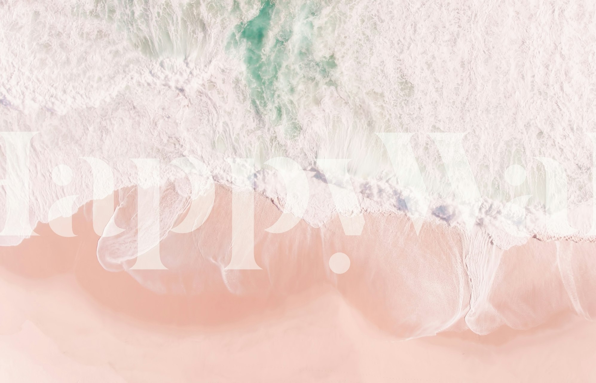 Aerial view of a beach with pastel pink sand and gentle white waves for a wall mural