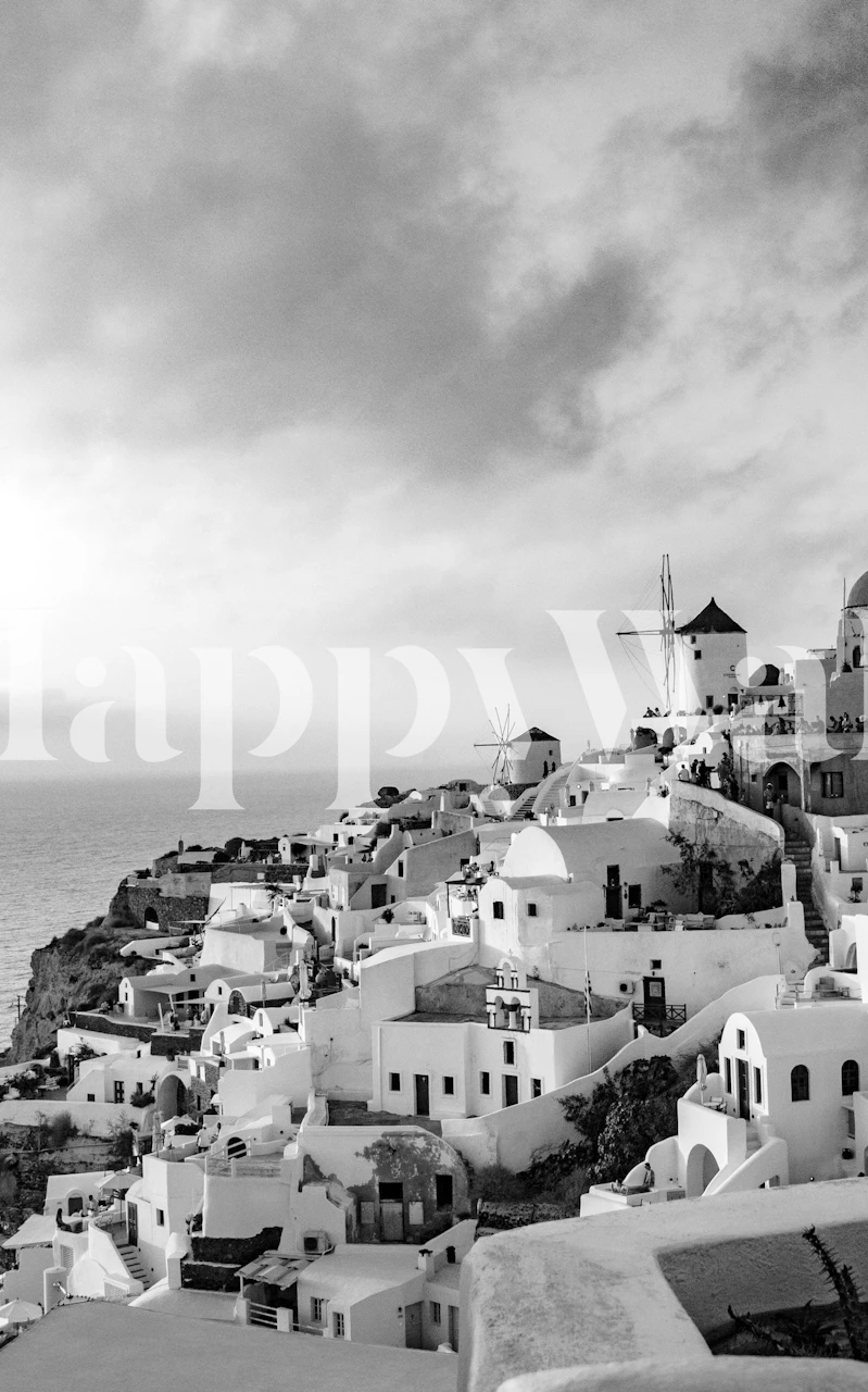 Fototapeta Santorini Sunset Bliss 5 przedstawiająca bieloną grecką architekturę z wiatrakiem