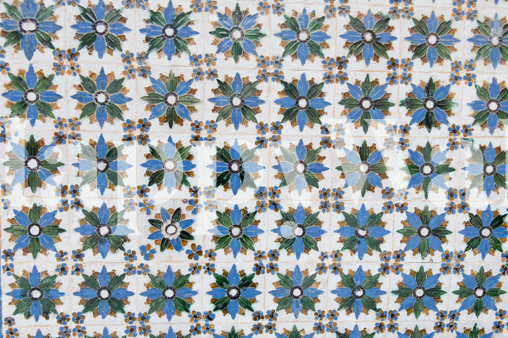 Spanish tiles wallpaper design with blue floral patterns and green leaves in a repeating layout