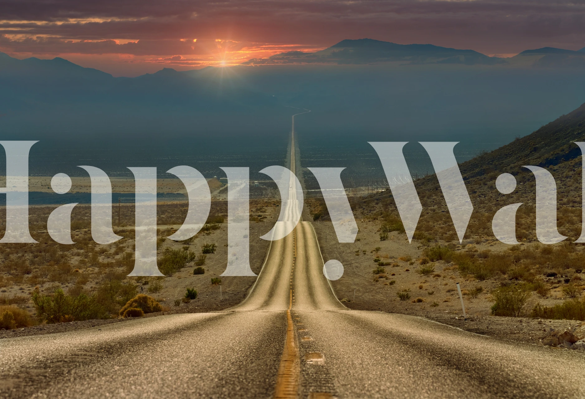 Desert road leading to mountains at sunset wallpaper