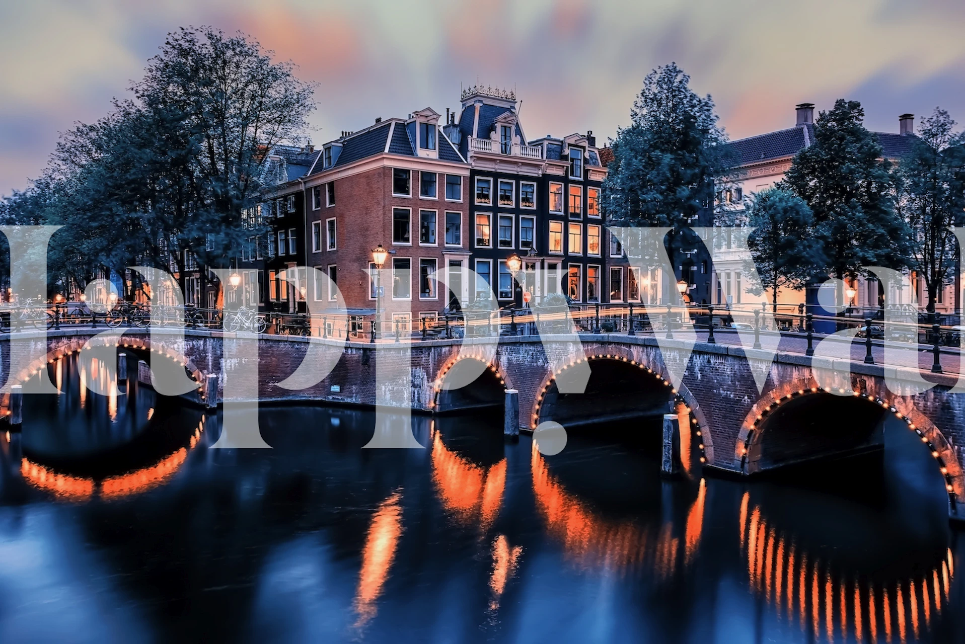 Amsterdam cityscape wallpaper featuring a sunset reflection in water, with historic houses and bridges.