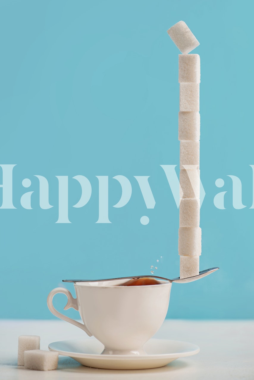 Sugar cubes balanced on a teaspoon over a tea cup against a pastel blue background