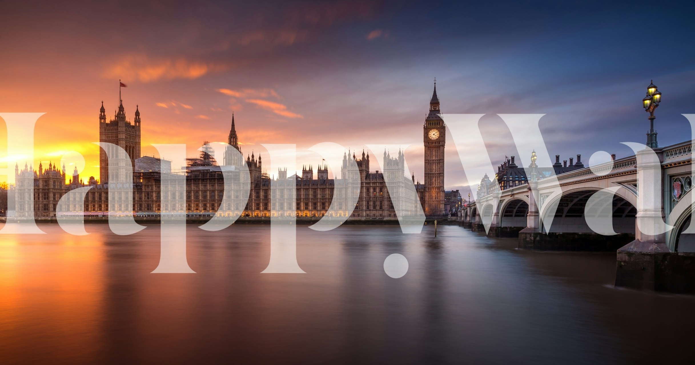 London Palace of Westminster and Westminster Bridge at sunset with orange and blue sky