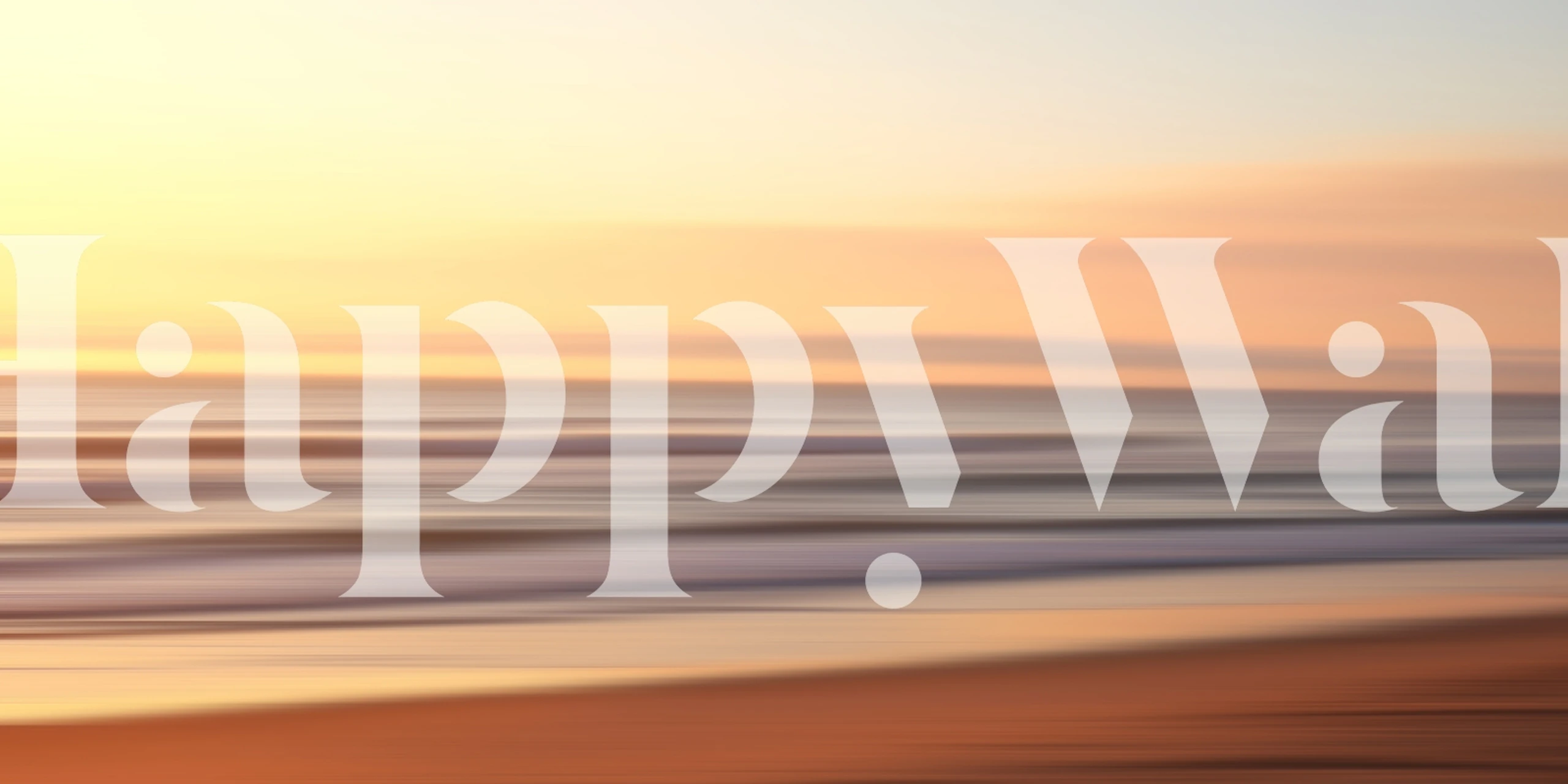 Blurred ocean sunset with orange and blue hues wallpaper