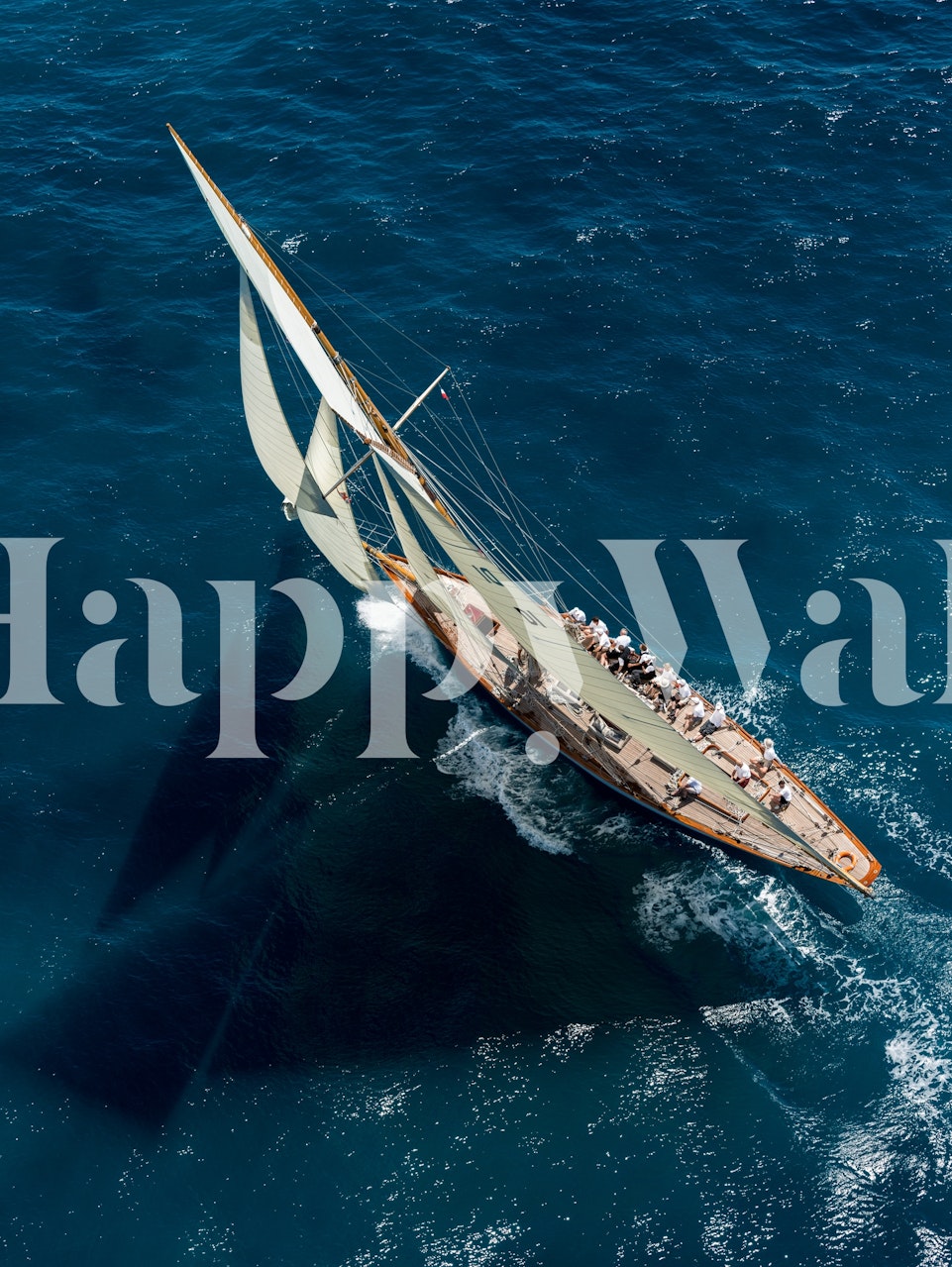 Sailing boat on blue ocean water wallpaper