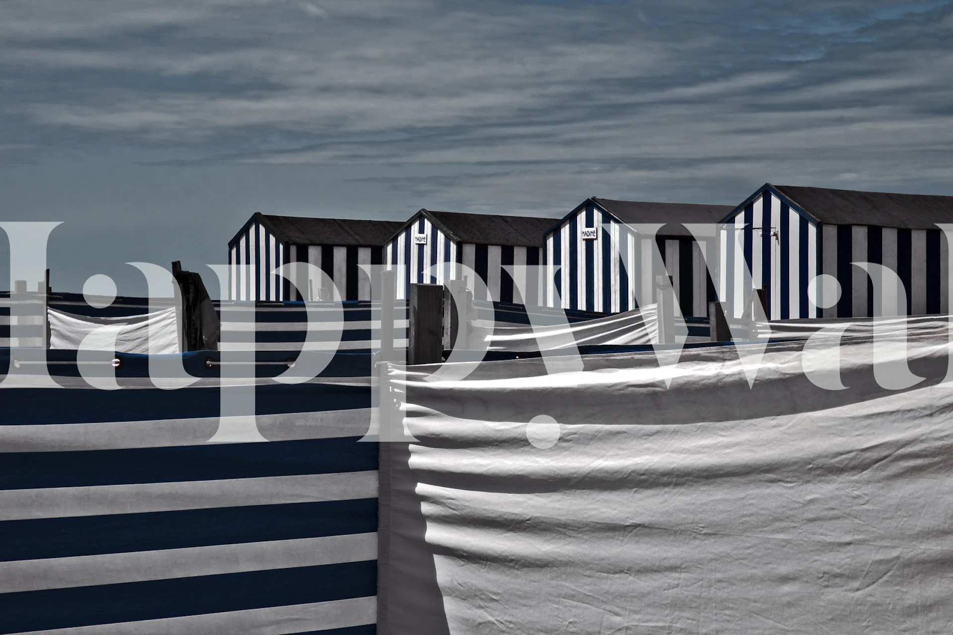 Striped beach huts with blue and white patterns wallpaper