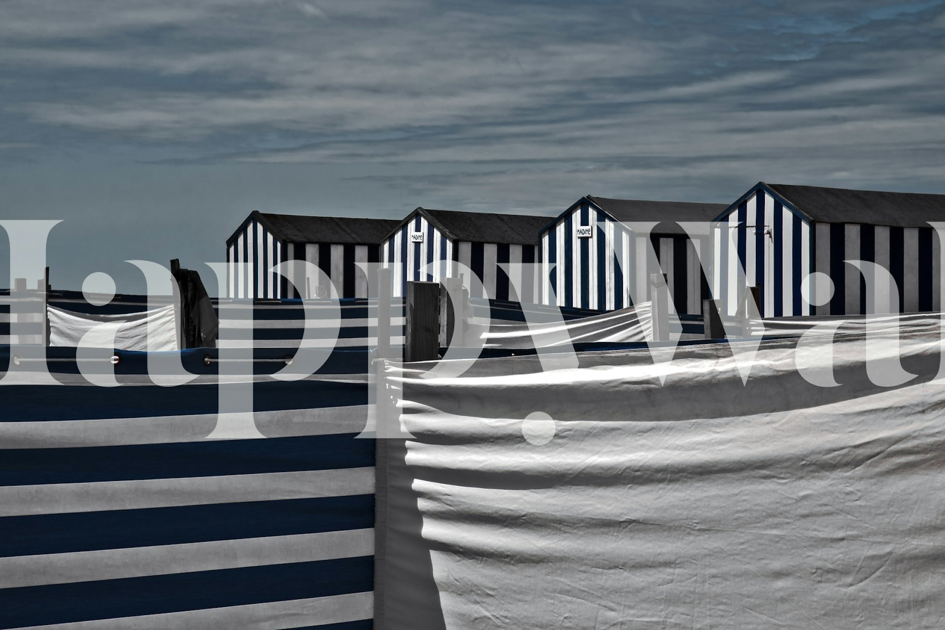 Striped beach huts with blue and white patterns wallpaper