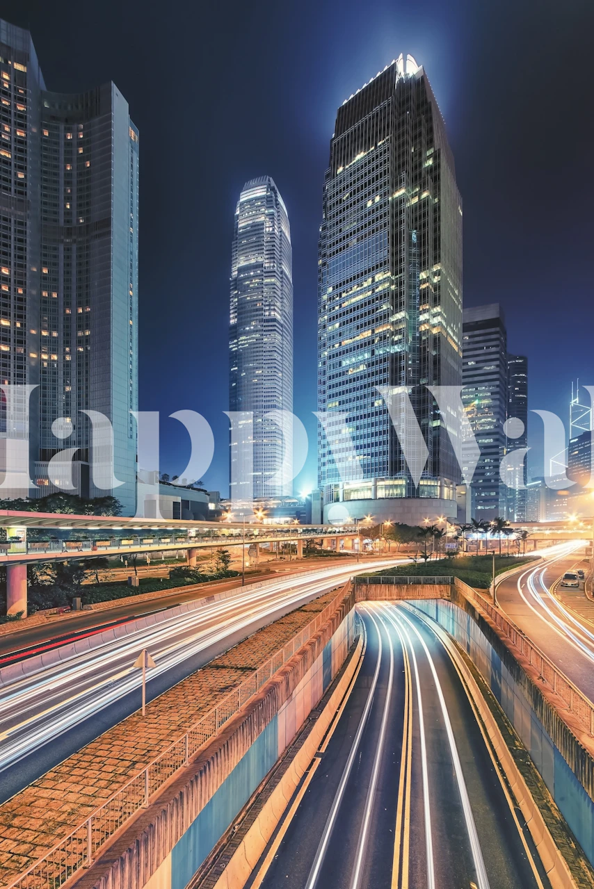 Wall mural of a vibrant cityscape at dusk with illuminated skyscrapers and light trails from moving traffic