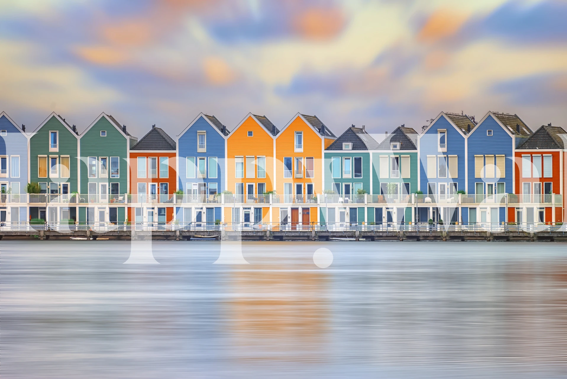 Colorful Dutch houses with orange, blue, green, and yellow colors, reflecting on calm water wallpaper