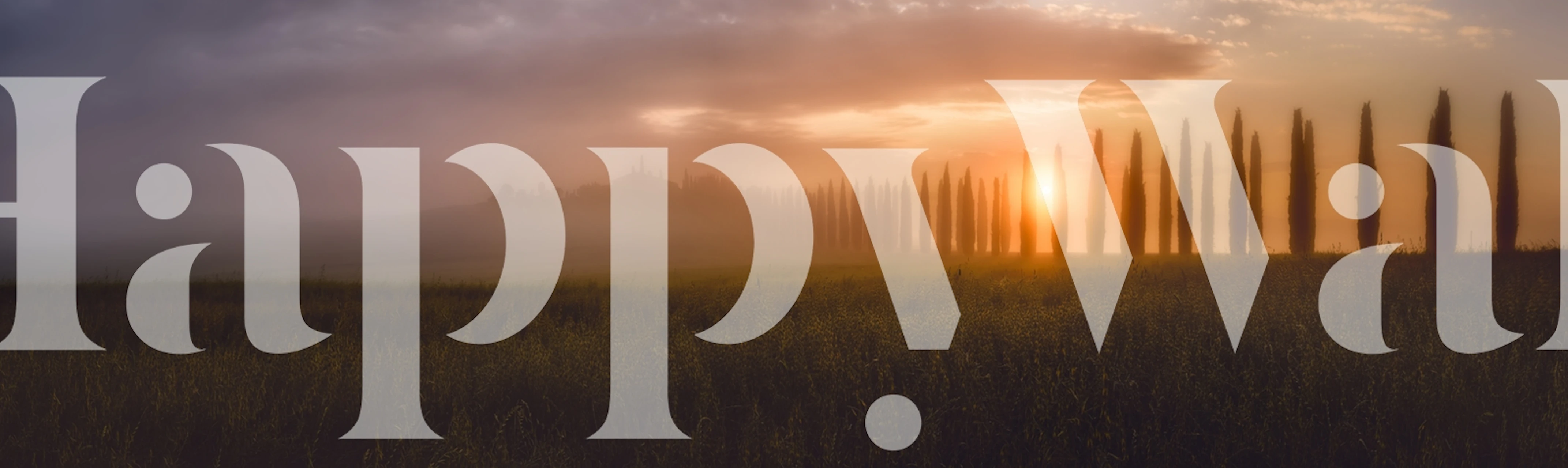 Tuscany sunrise landscape wallpaper featuring misty hills, cypress trees, and warm sunrise colors