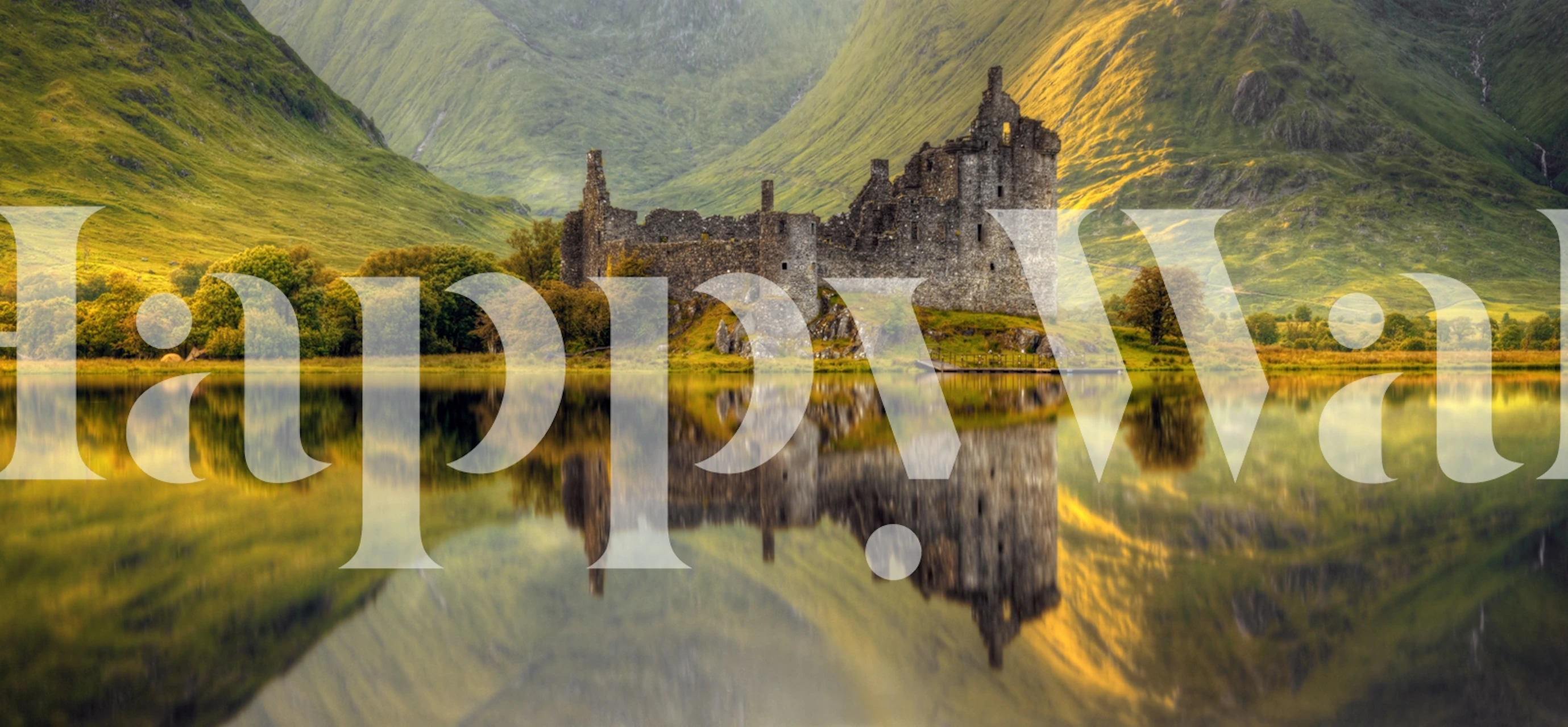 Castle ruins surrounded by lush greenery and mountains wallpaper