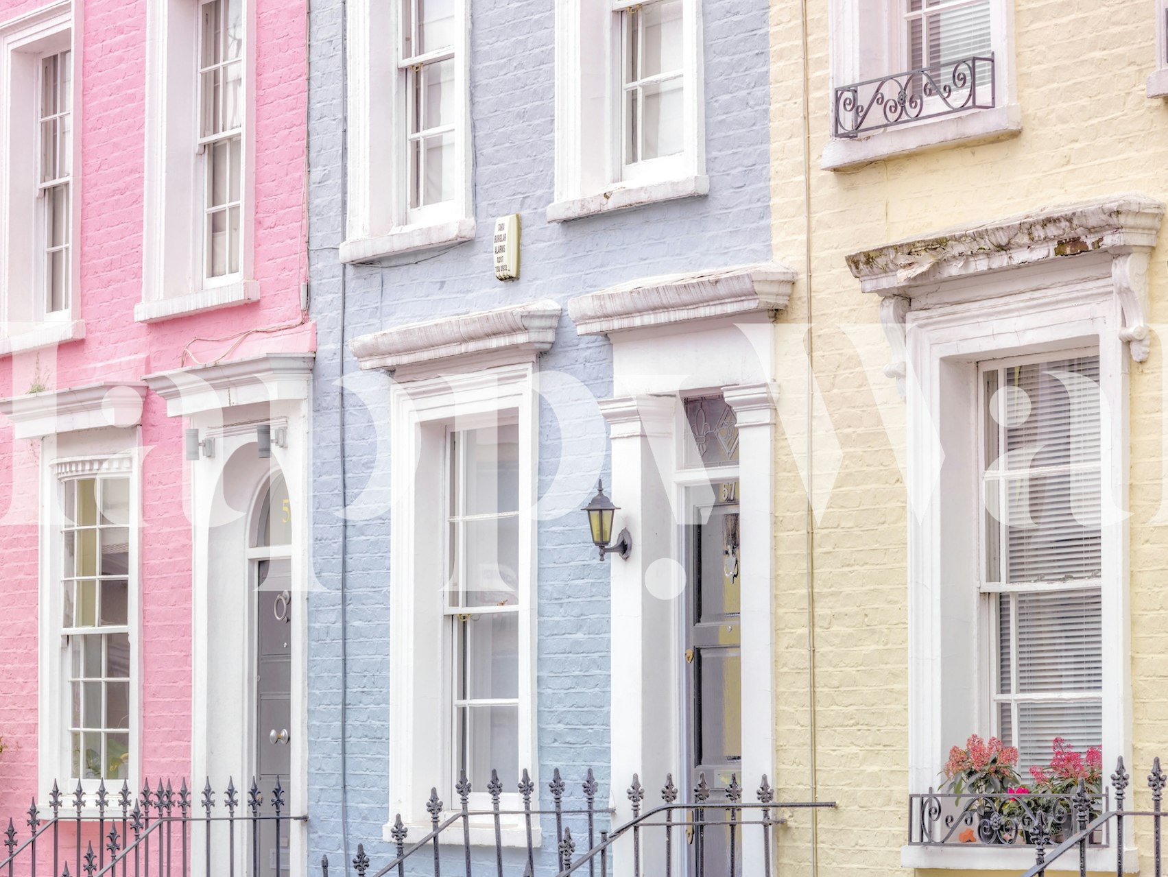 Pastel-colored Portobello townhouses wall mural with charming urban street scene