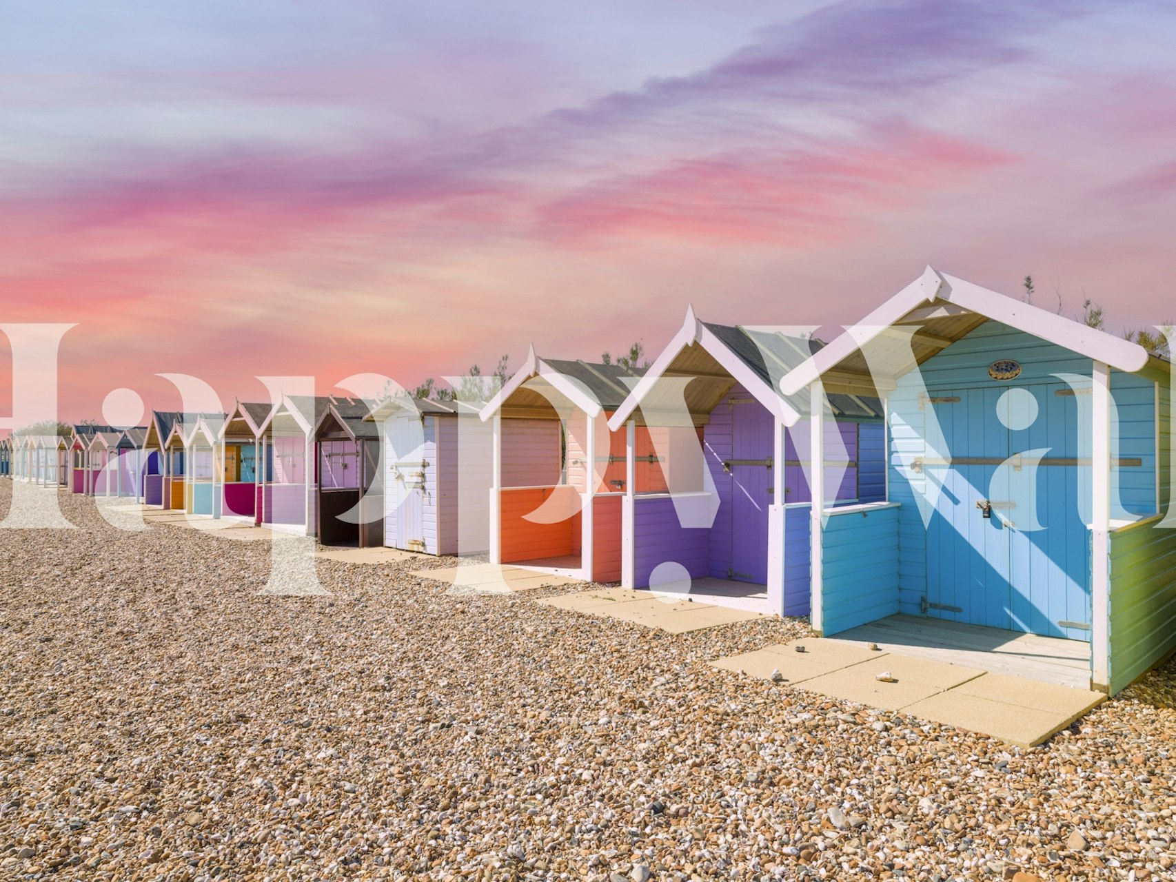 Vibrant multicolored beach huts on wallpaper