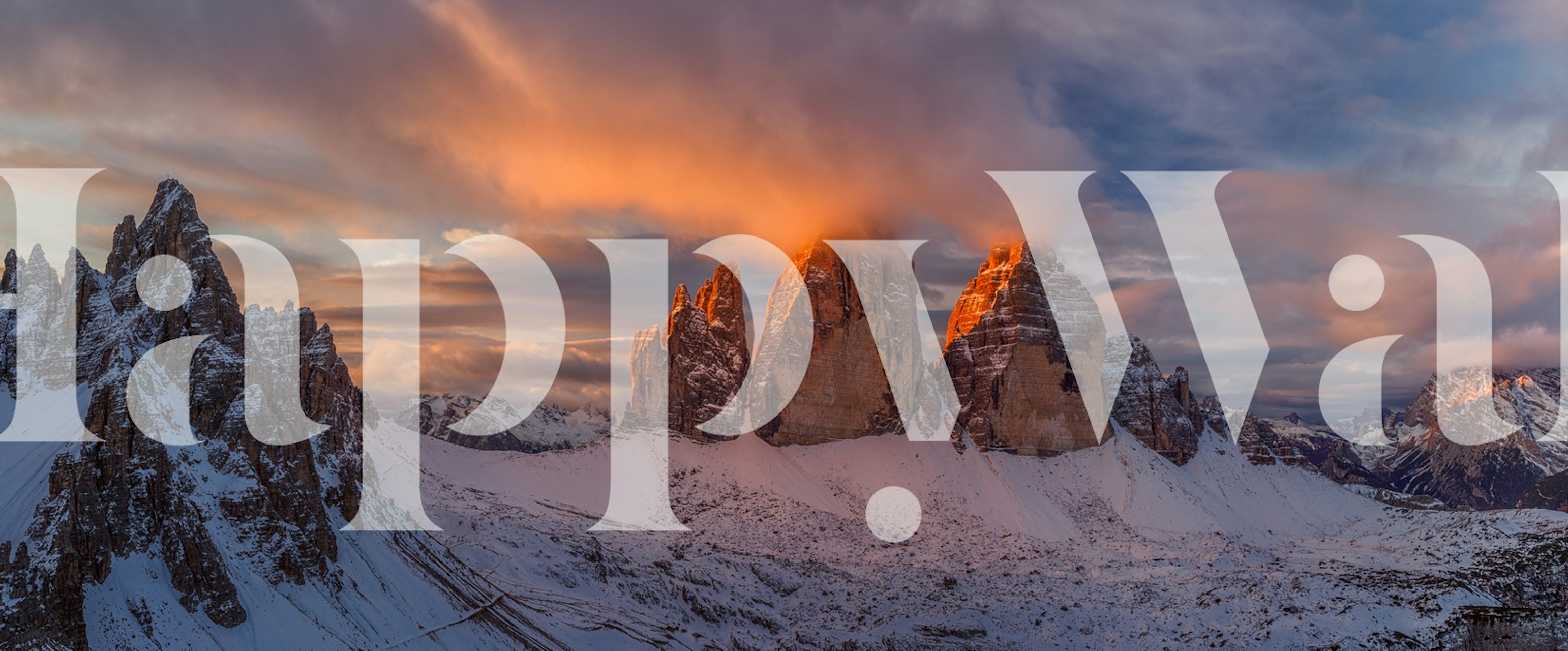 Mountain landscape with sunset hues and snowy peaks wallpaper