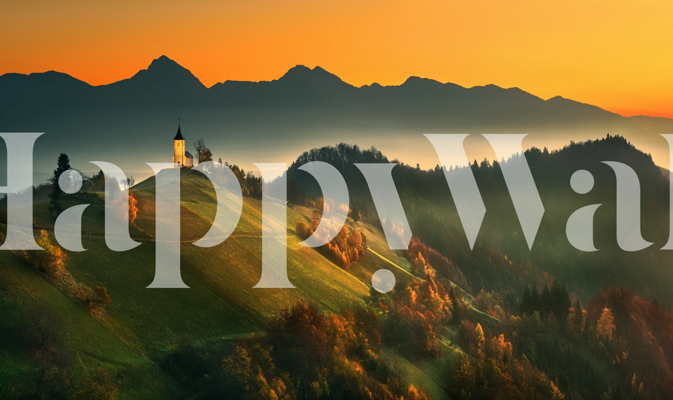 Serene autumn landscape wallpaper featuring warm orange tones, mountains, and a church tower