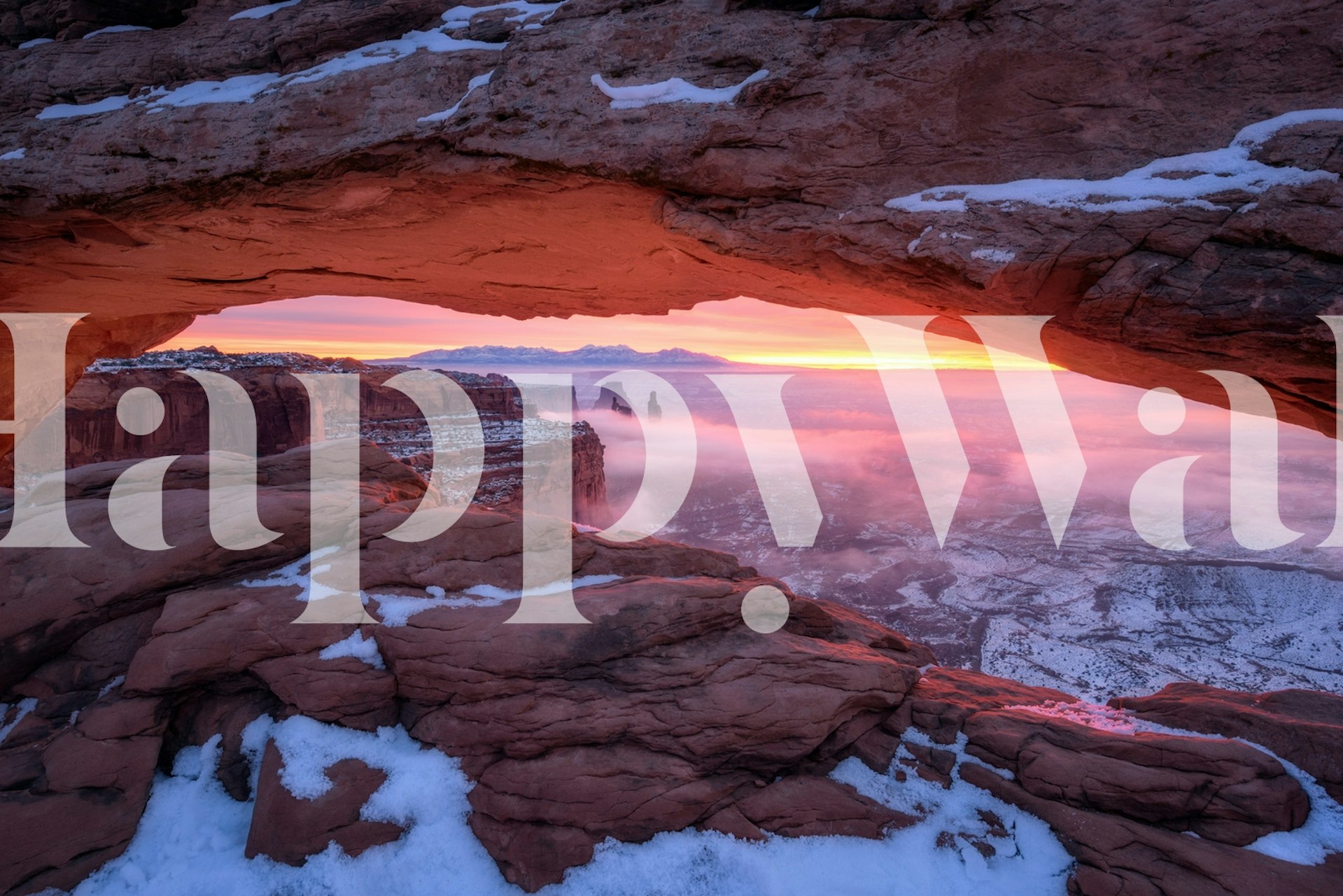 Pink and purple sunrise landscape wallpaper with rocky formations