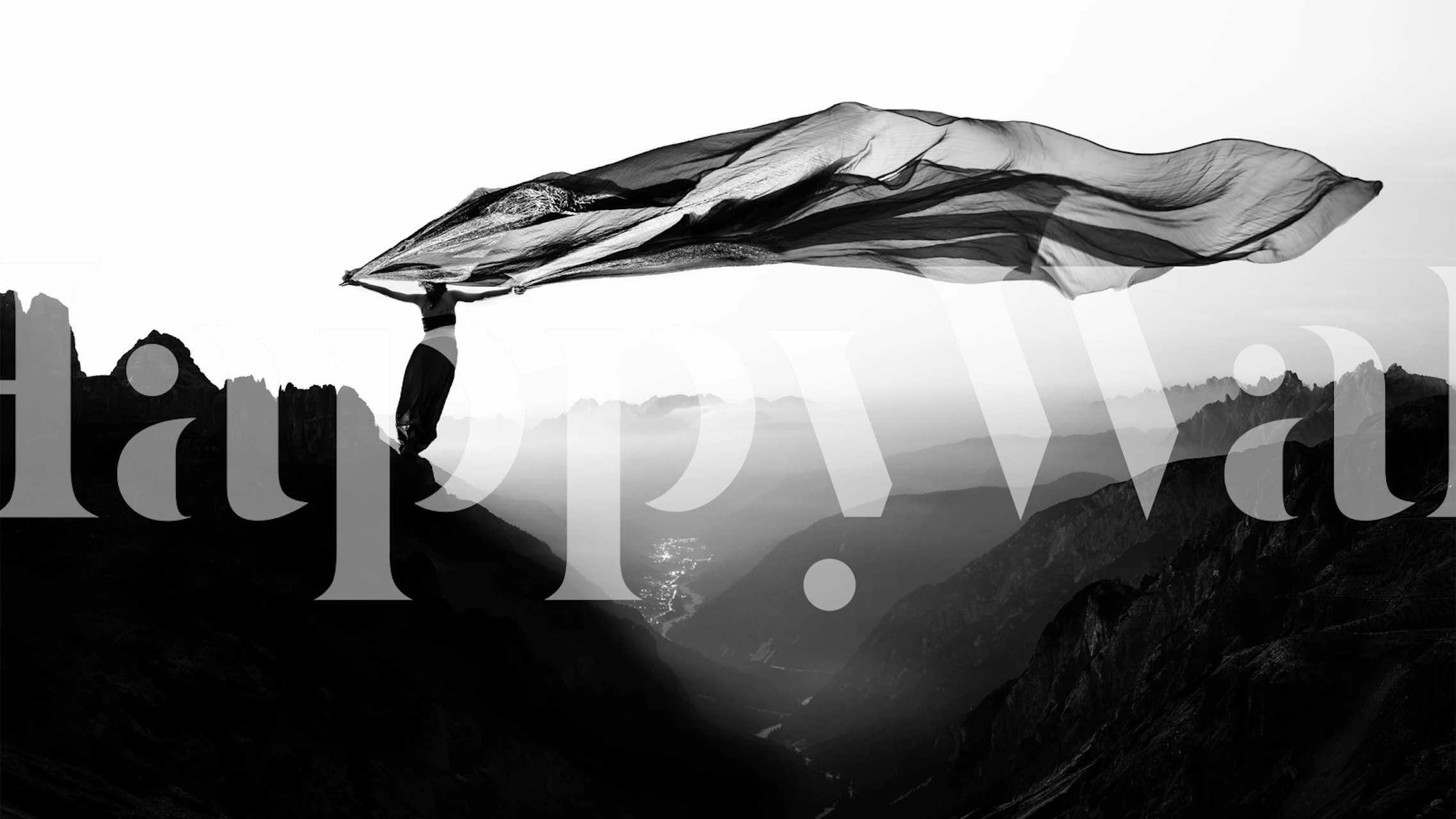 Monochrome fabric blowing in the wind over mountain peaks wall mural