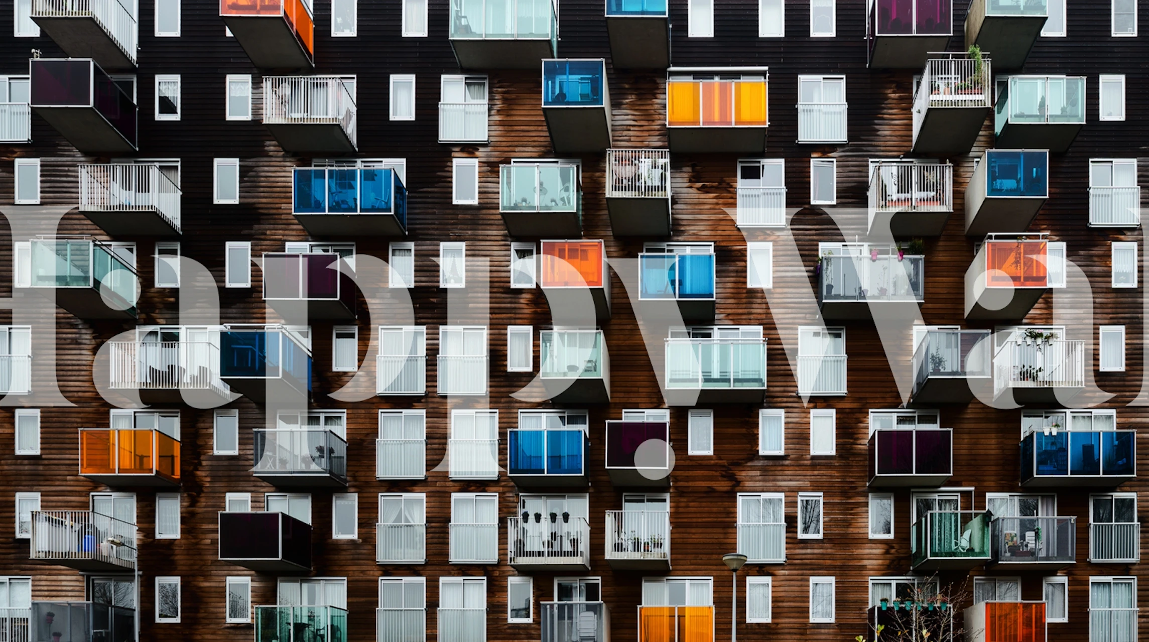 Colorful balconies on a wooden facade wallpaper