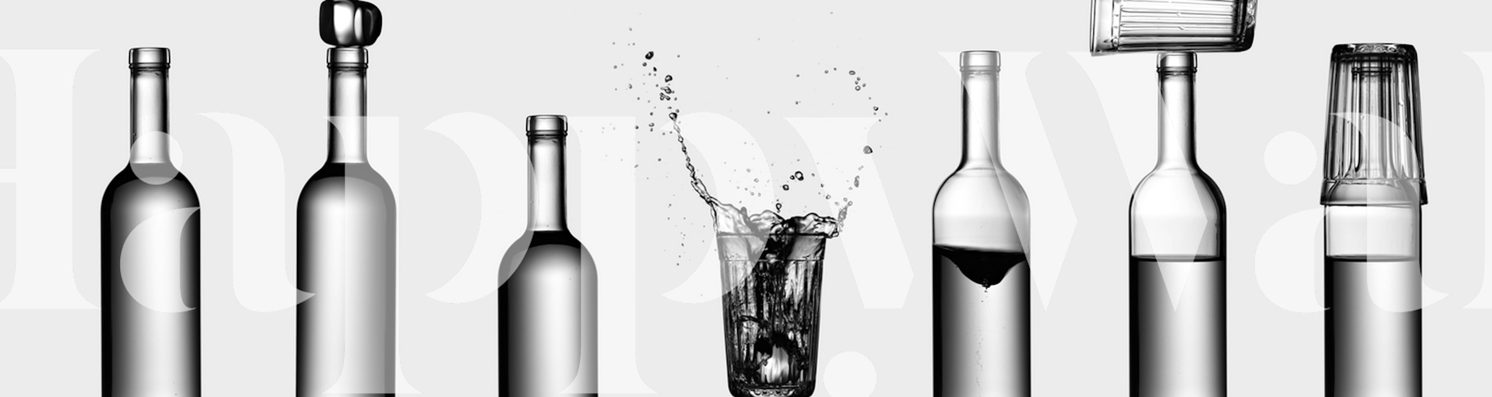 Transparent bottles with splashing water on a gray background wallpaper