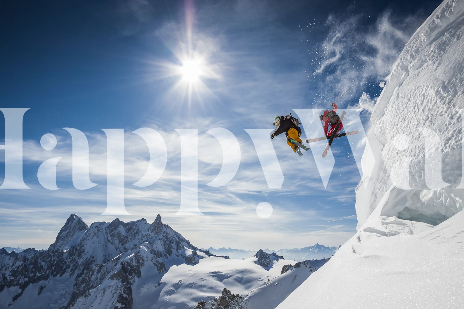 Two skiers jumping over snowy mountains with a bright blue sky, action-packed wallpaper