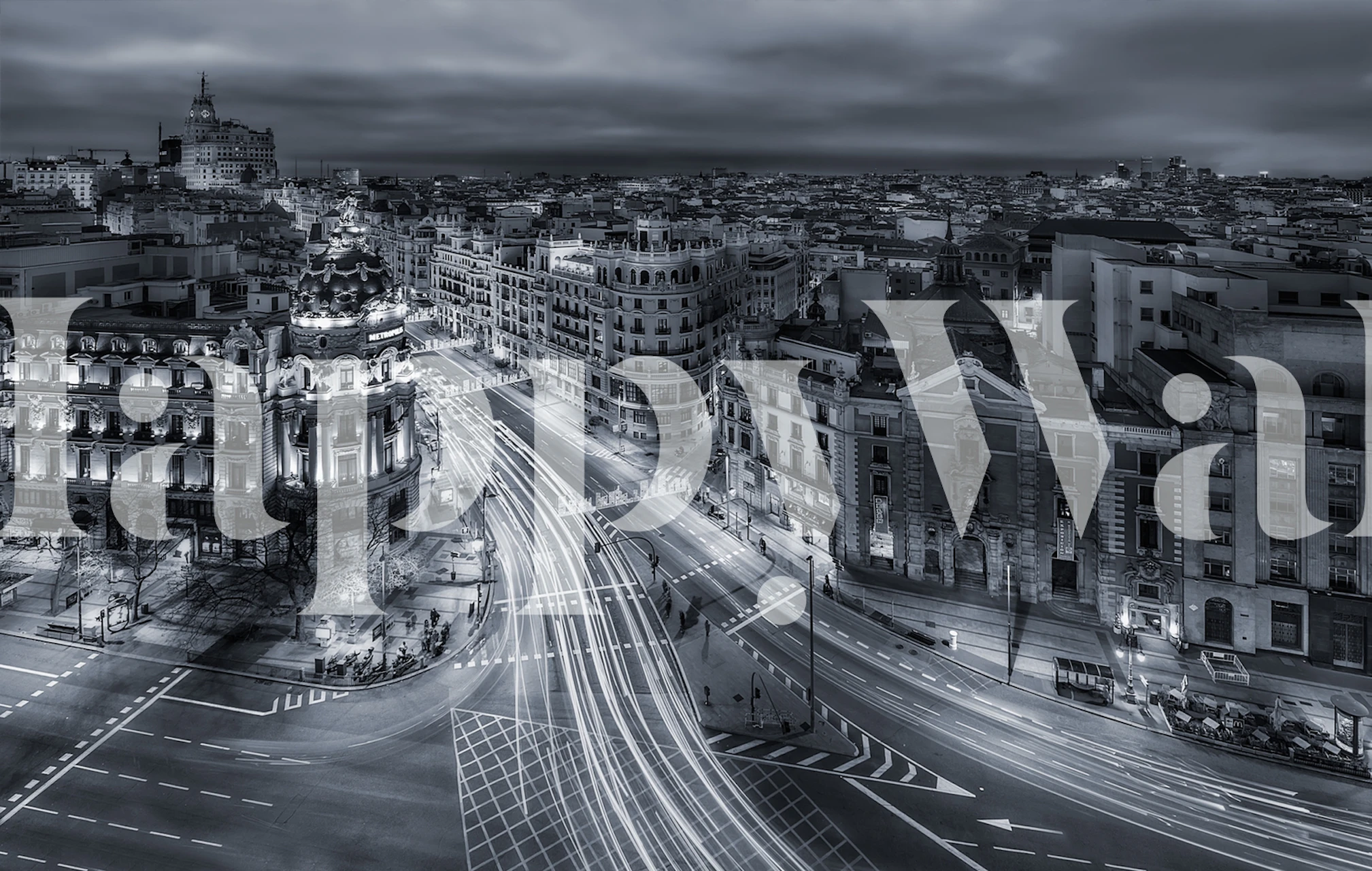 Black and white cityscape wallpaper with illuminated street lights