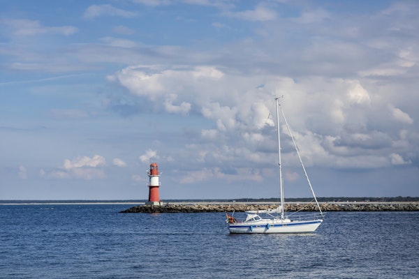 Baltic Sea Lighthouse And Boat