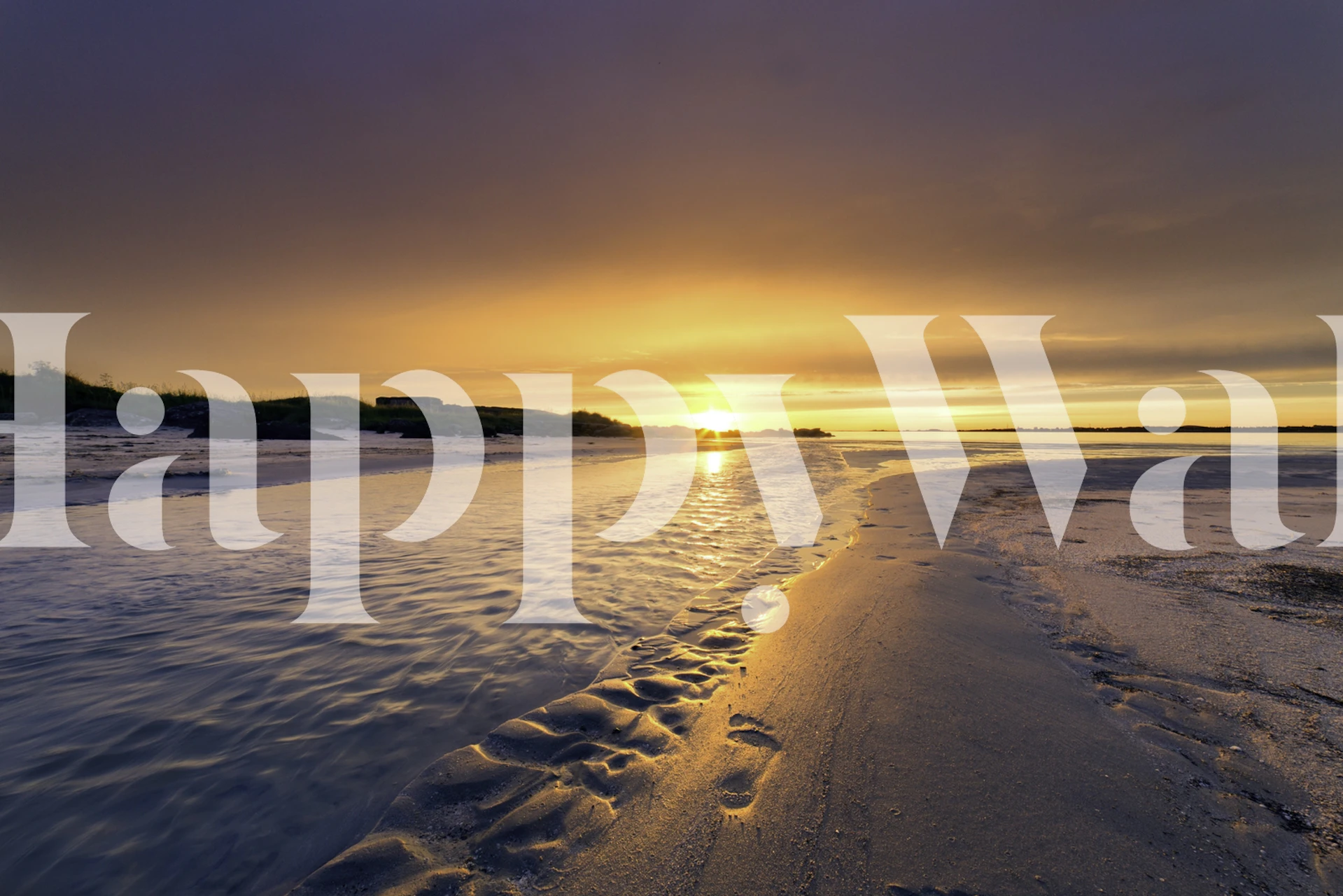 A tranquil beach scene at sunset with footprints in the sand wall mural.