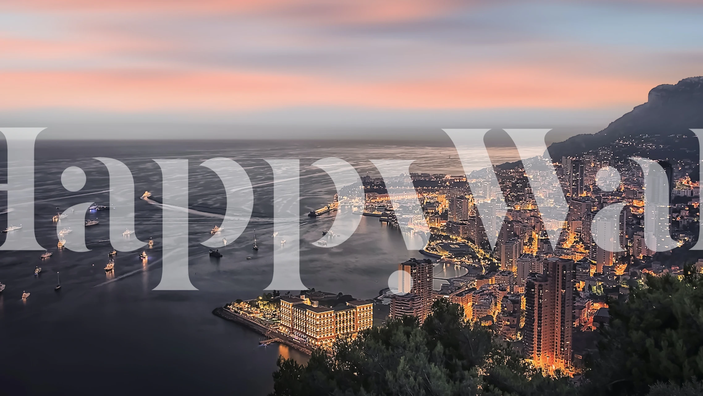 Monaco cityscape wallpaper featuring soft sunset hues over buildings and water