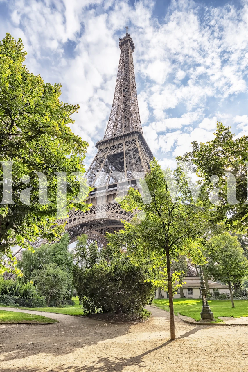 Eiffel Tower surrounded by trees and blue sky wallpaper