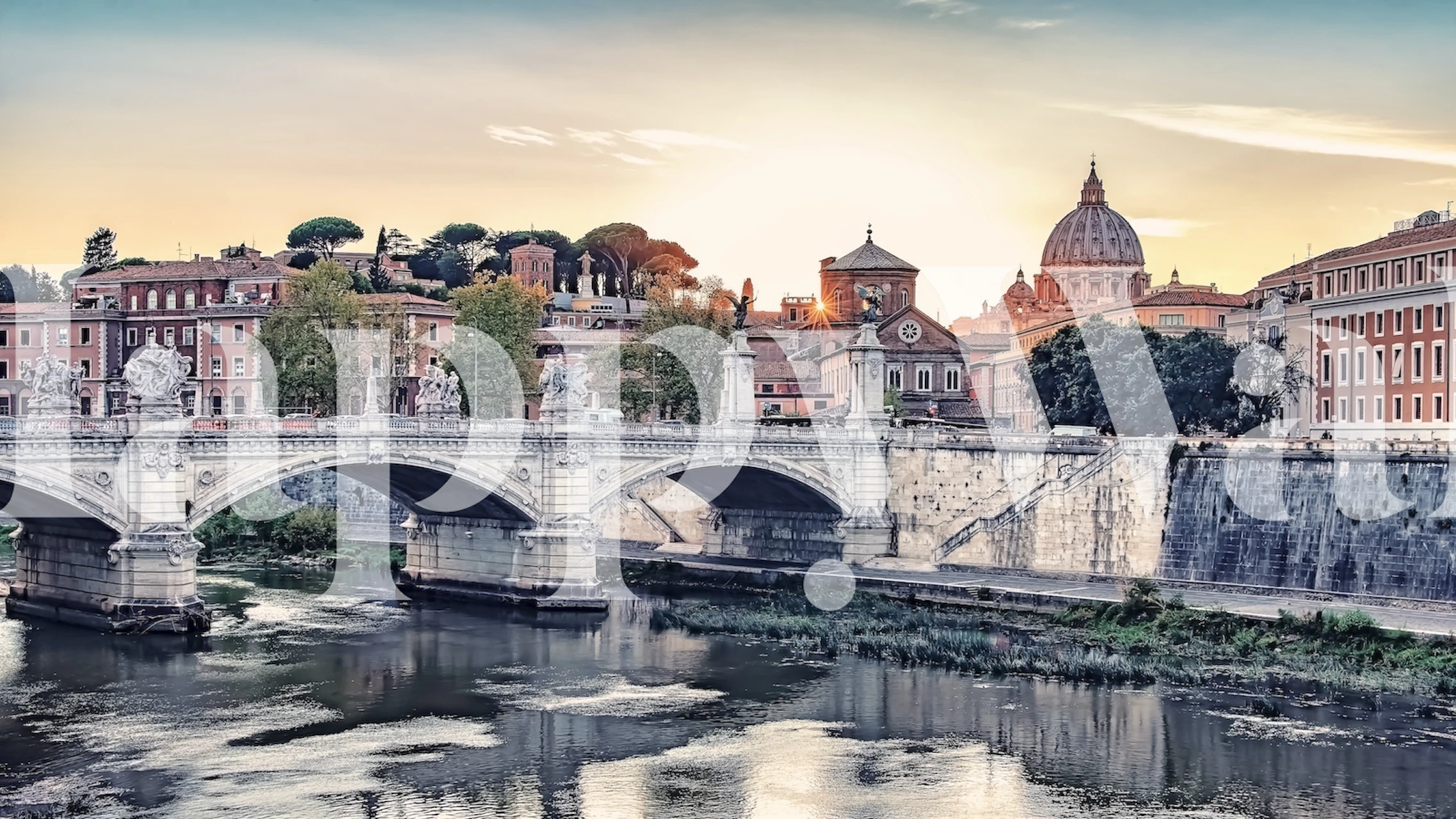 Scenic wallpaper of a bridge at sunset in Rome featuring soft colors and historical architecture